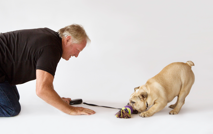 Mark playing with pup